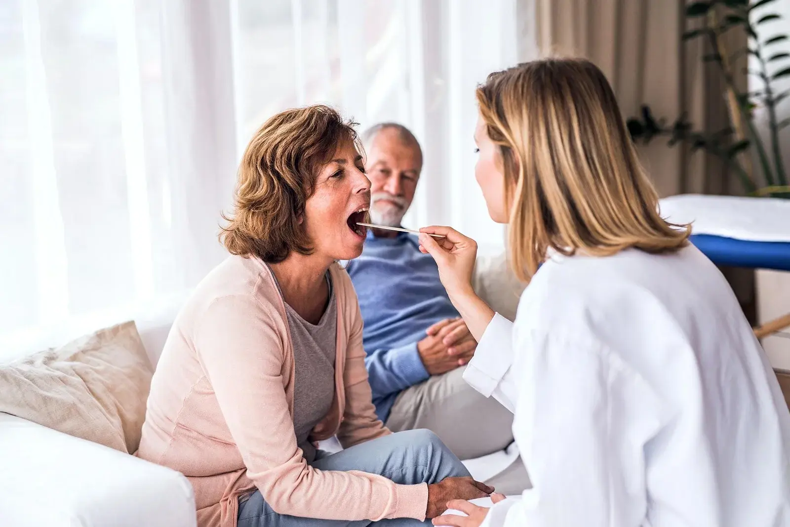 Female Doctor Examining Senior Woman